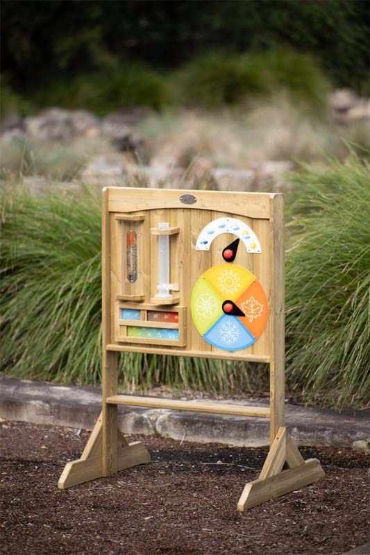The Classic Outdoor timber weather station board in a garden